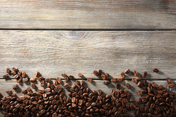 Coffee beans on wooden background