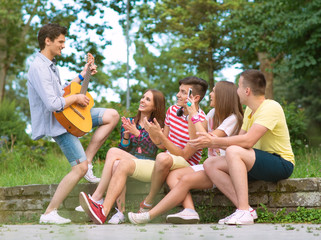 Group of friends playing music