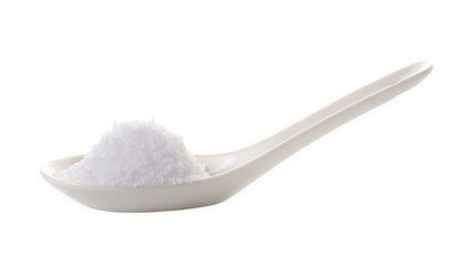 Fototapeta na wymiar sea salt in spoon on white background