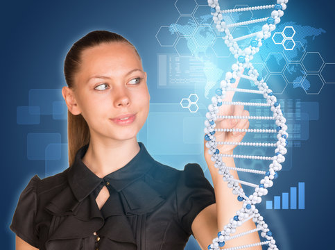 Beautiful woman pointing finger on DNA model