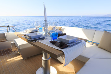 lunch on motor yacht, Table setting at a luxury yacht. © Andrea