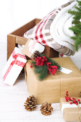 Christmas presents  near Christmas tree on light background