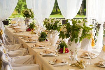 Decorated chair and tables set for wedding