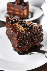 Yummy chocolate cake served on table, close-up