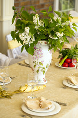 Decorated chair and tables set for wedding