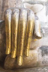 Hand of Buddha statue covered with gold sheet