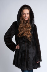 beautiful woman wearing fur coat