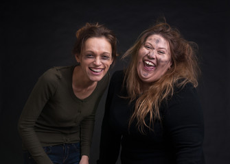 drunk two women over black background