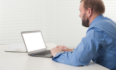 mature businessman working on his laptop