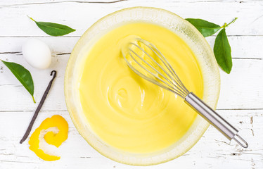 Custard pastry cream.Preparation of sweet cream in a bowl.
