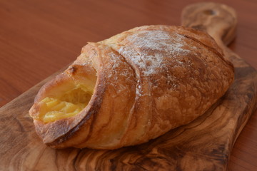Fresh baked croissant with vanilla filling