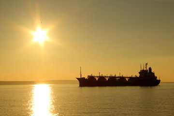 silhouette tanker on sunset background - 73475862