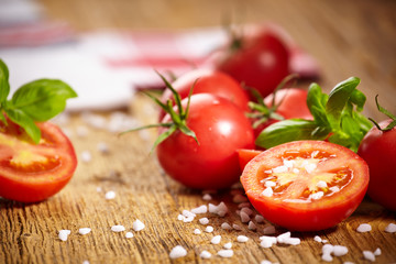 Tomatoes lying on old table. Diet food