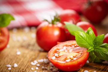 Tomatoes lying on old table. Diet food