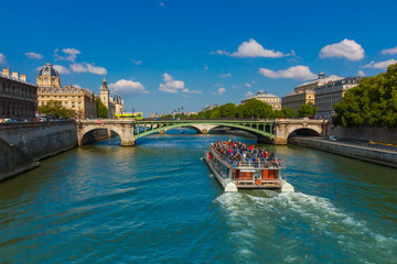 Tourist boat on river Seine in Paris, France