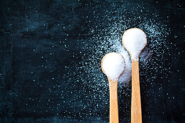 Fototapeta na wymiar sugar in wooden spoons