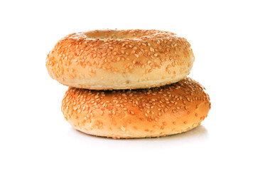 Two Bagels with sesame seeds on white