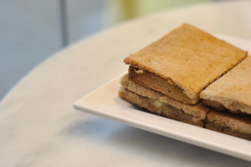 Many crispy bread on white plate
