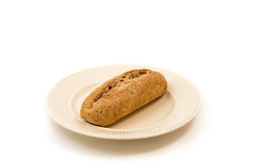 One baguette on an off-white plate