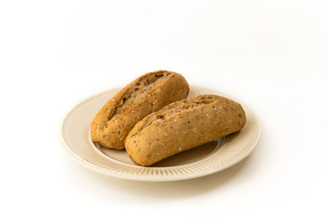 Two baguettes on an off-white plate