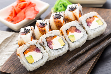 Sushi roll with salmon, tuna and eel