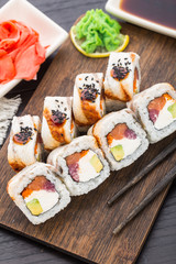 Sushi roll with salmon, tuna and eel