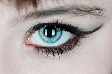Woman with blue eye staring at you