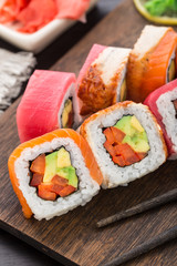 Rainbow sushi roll with salmon, tuna and eel