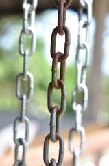 Rusty and steel chains hanging