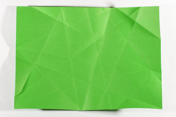 Unfolded green sheet of A4 paper