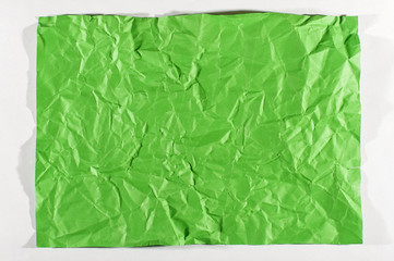 Wrinkled green A4 sheet of paper isolated