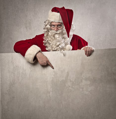 Santa Claus pointing out something