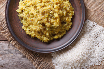 Khichdi close-up on a plate with ingredients. top view