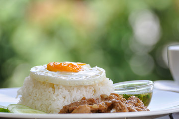 Garlic pork with jasmine rice and egg.