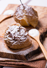 Baked apples on wooden board