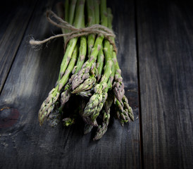 Bunch of fresh asparagus on a black background