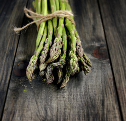 Bunch of fresh asparagus on a black background