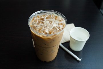 Iced coffee latte on wood table.