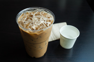 Iced coffee latte on wood table.