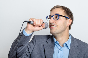 Business Man sings with microphone
