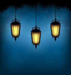 Fototapeta na wymiar Three illuminated lanterns with pine branches on blue background
