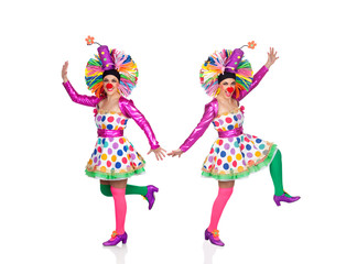 Two funny clowns dancing