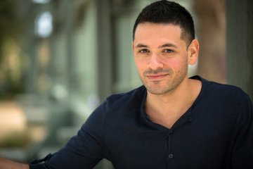 Obraz premium Portrait of a latino young man outside