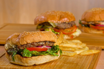 Tasty burger with melted cheese and thick succulent ground beef