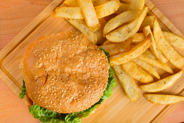 Tasty burger with melted cheese and thick succulent ground beef