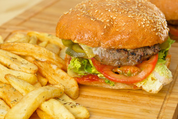 Tasty burger with melted cheese and thick succulent ground beef