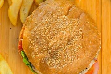 Tasty burger with melted cheese and thick succulent ground beef