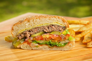 Cutted burger with melted cheese and thick succulent ground beef