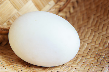 white egg on woven bamboo