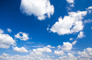 blue sky background with tiny clouds
